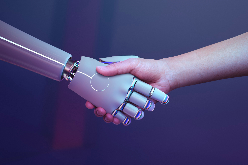 Uścisk ręki sztucznej inteligencji i człowieka